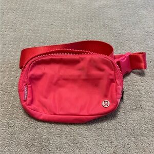 Pink lululemon cross body bag.